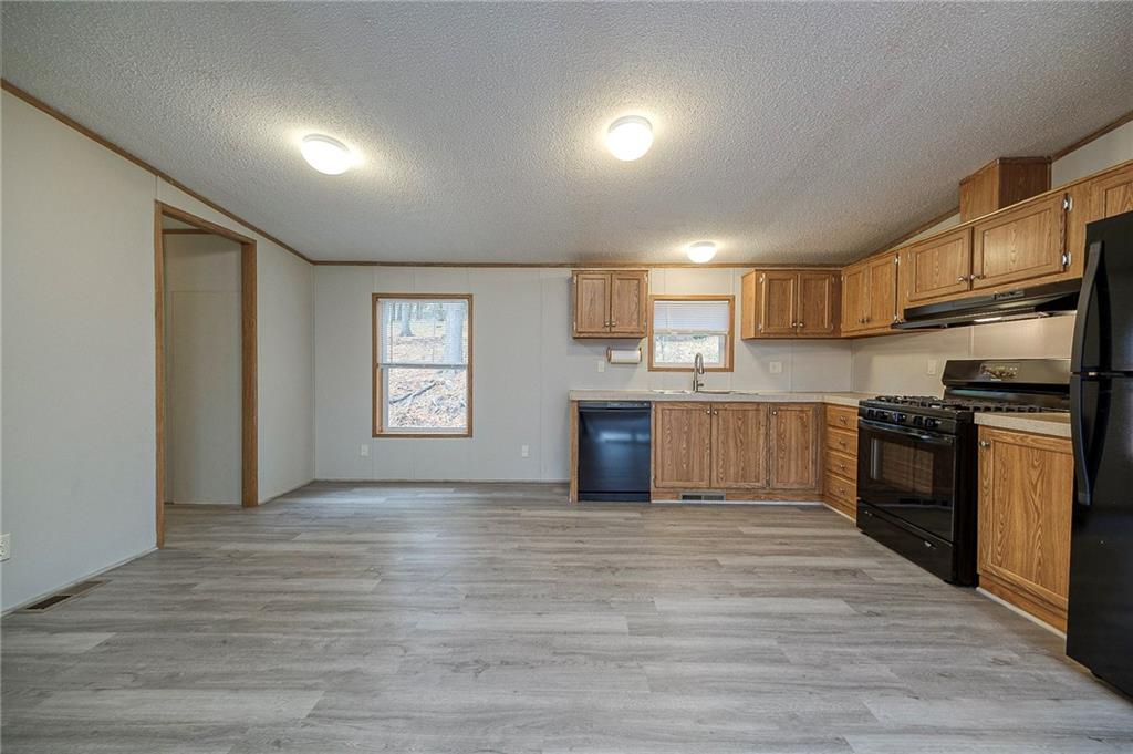 3454 Evergreen Road Pittsburgh, PA 15237 - Photo 10 of 25 a kitchen with stainless steel appliances granite countertop a refrigerator and a stove top oven