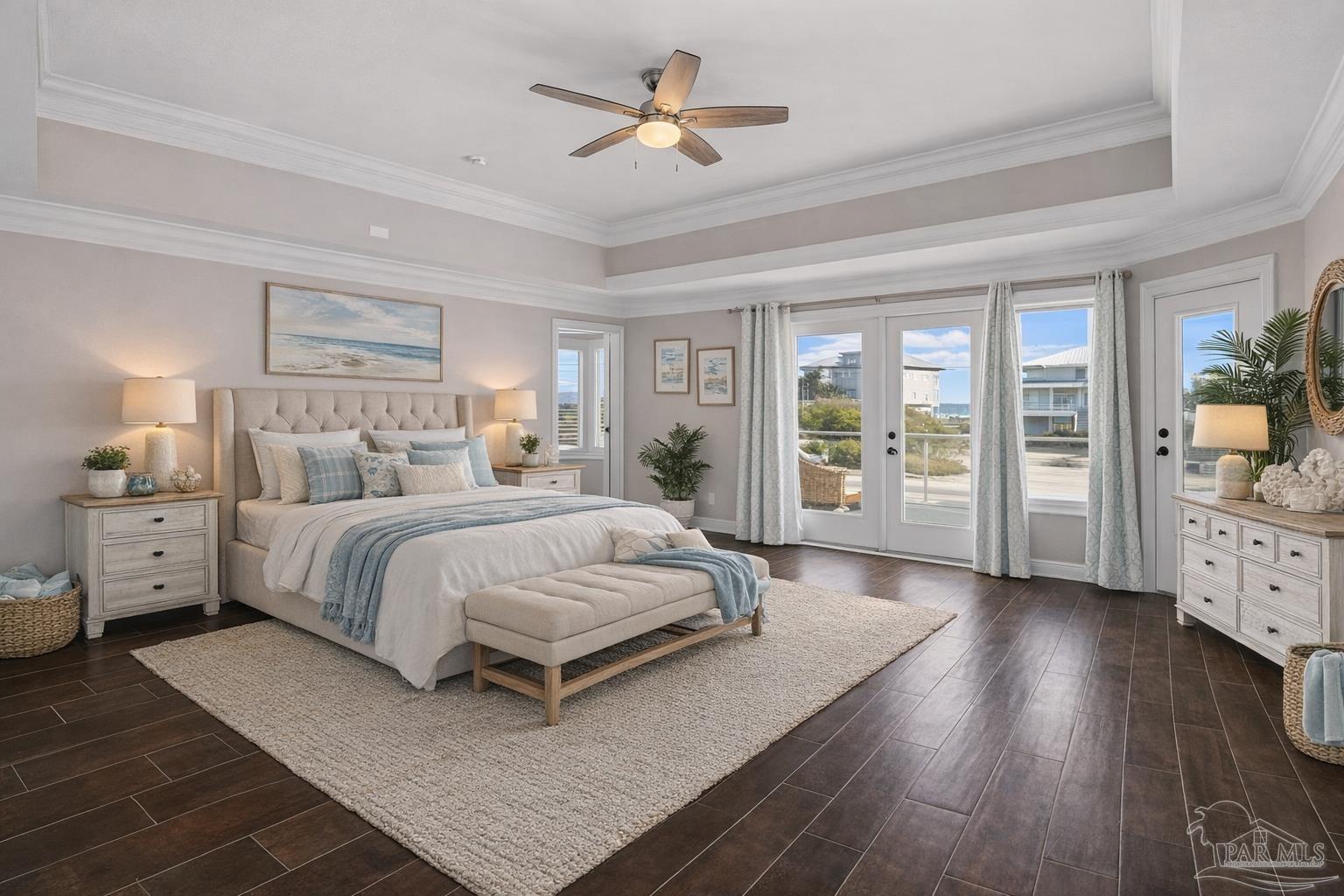 321 Gulfview Lane Perdido Key, FL 32507 - Photo 5 of 57 a spacious bedroom with a large bed and a chandelier
