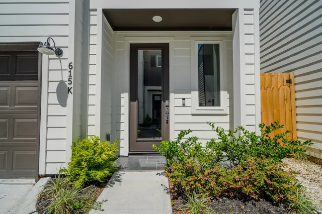 front view of a house with a potted plant