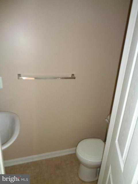 1736 Waltman Road Edgewood, MD 21040 - Photo 7 of 21 a white toilet sitting next to a sink