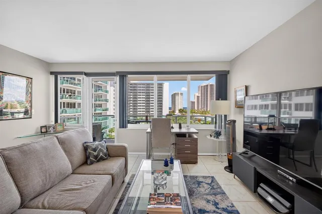 a living room with furniture large window and flat screen tv