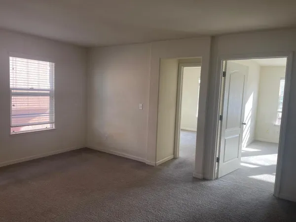a view of empty room with windows