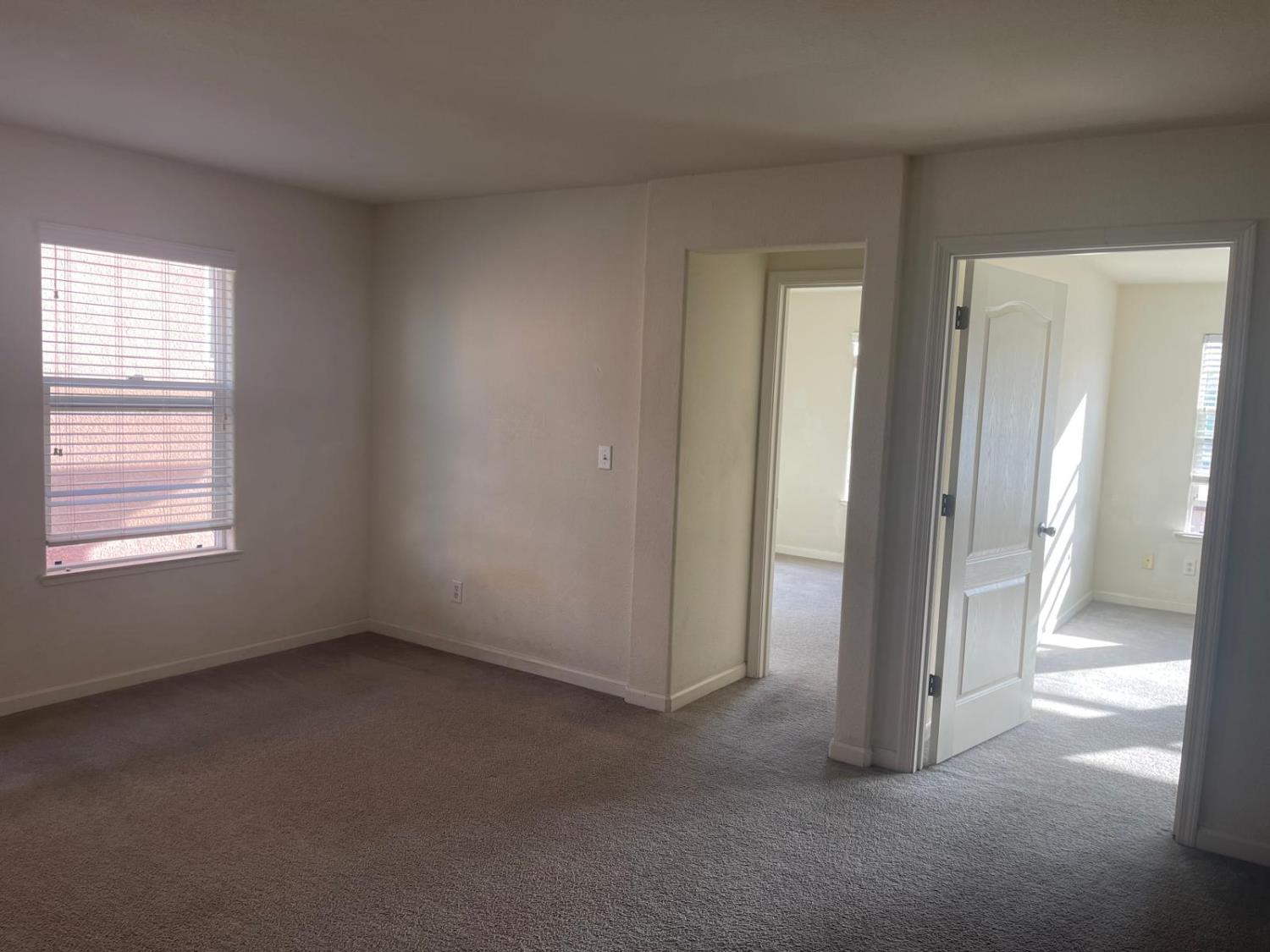 1006 Papaya Street Madera, CA 93638 - Photo 14 of 17 a view of empty room with windows