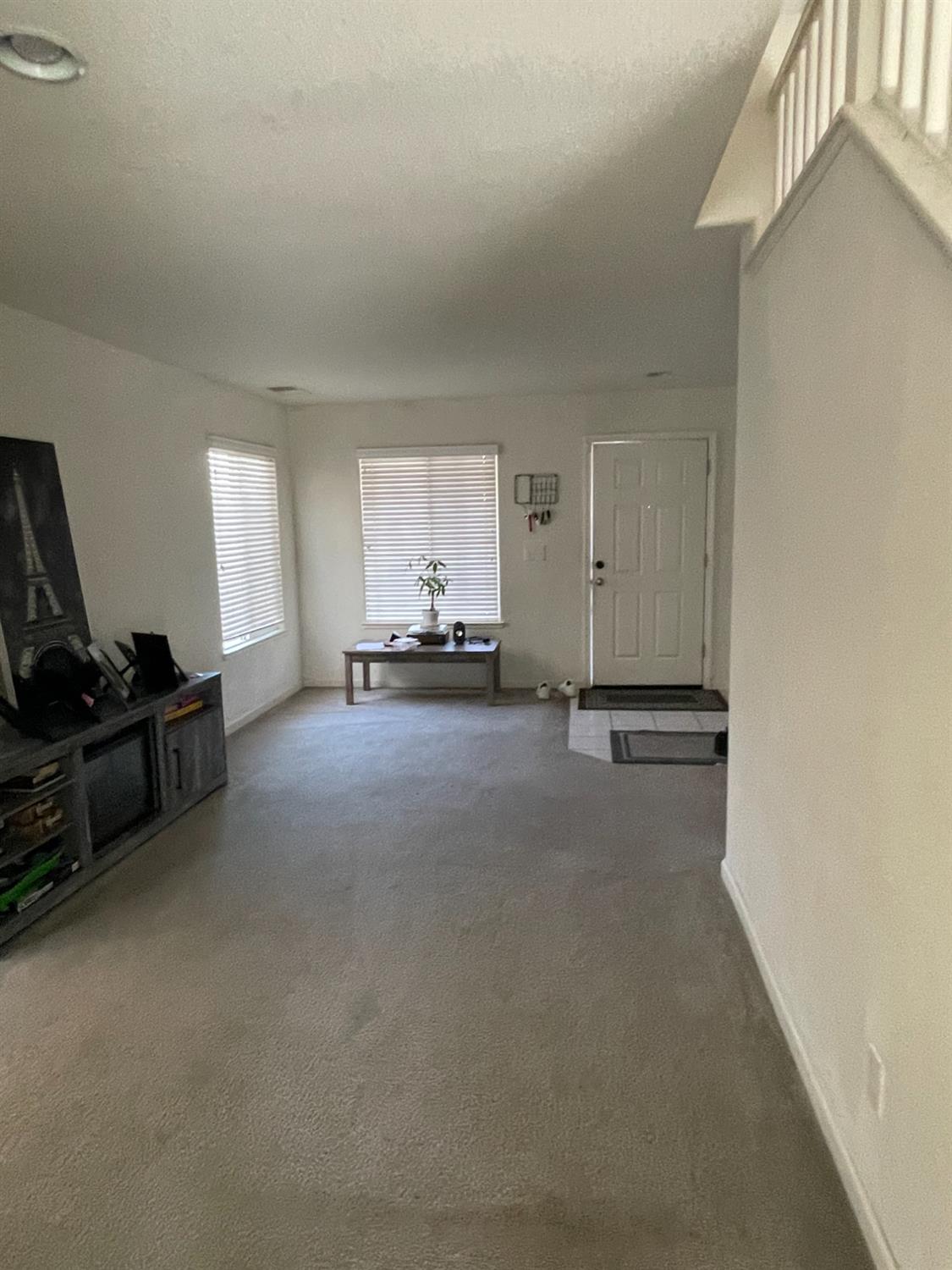 1006 Papaya Street Madera, CA 93638 - Photo 4 of 17 a living room with furniture and a flat screen tv