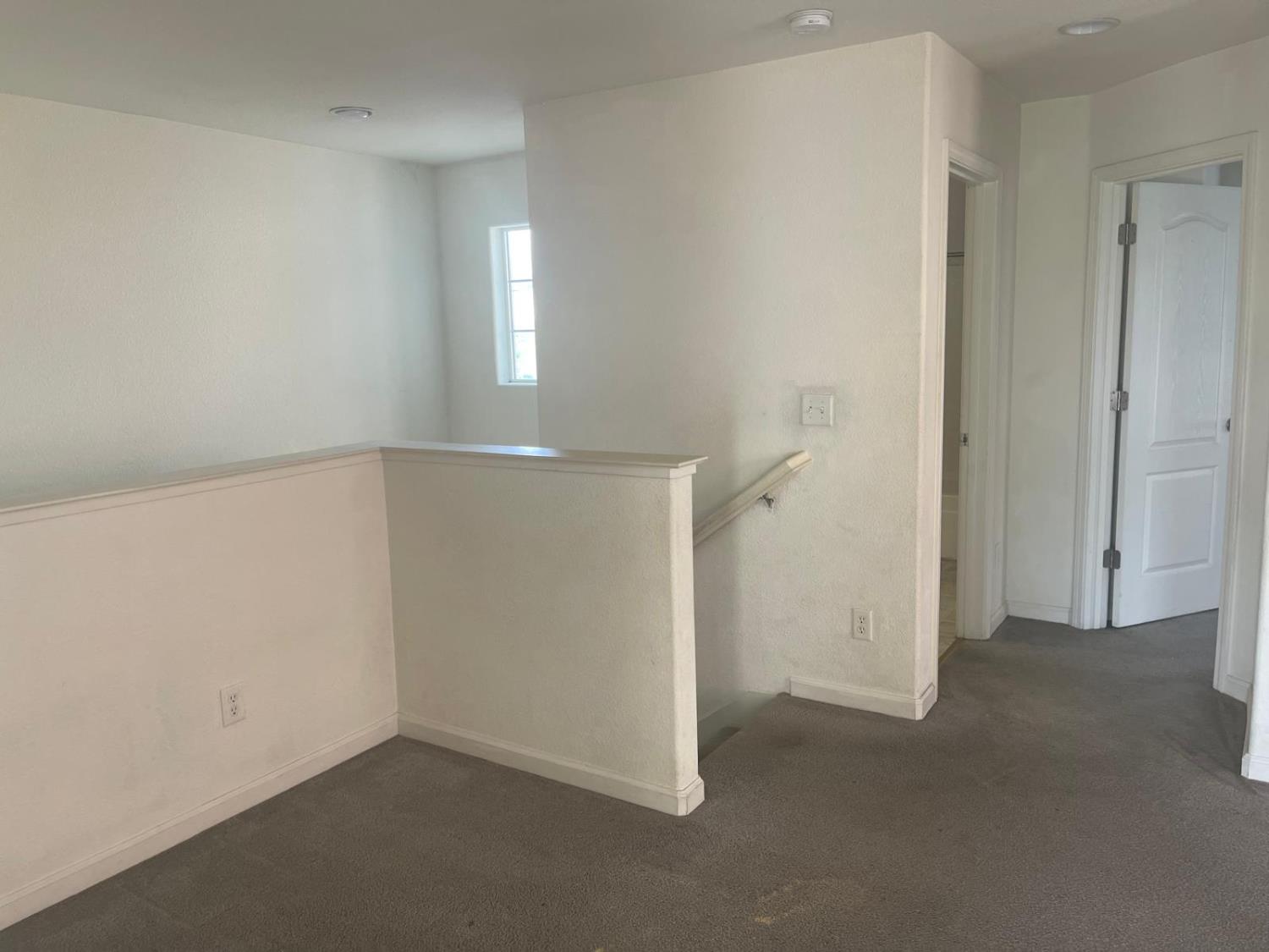 1006 Papaya Street Madera, CA 93638 - Photo 7 of 17 an empty room with an entryway