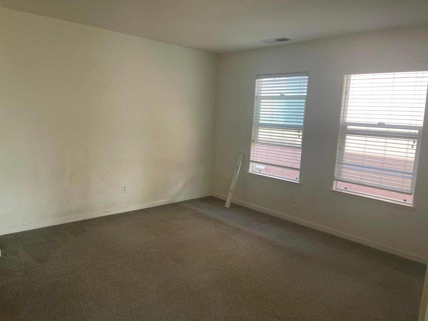1006 Papaya Street Madera, CA 93638 - Photo 8 of 17 an empty room with a window