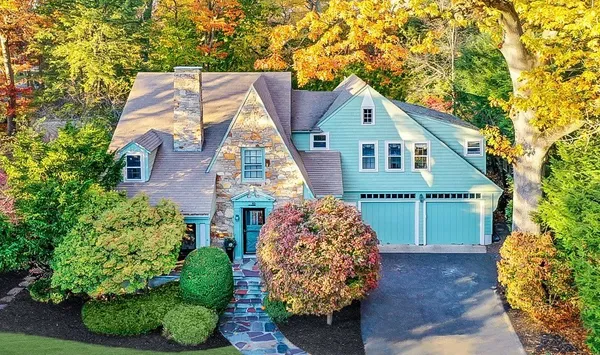 a front view of a house with garden