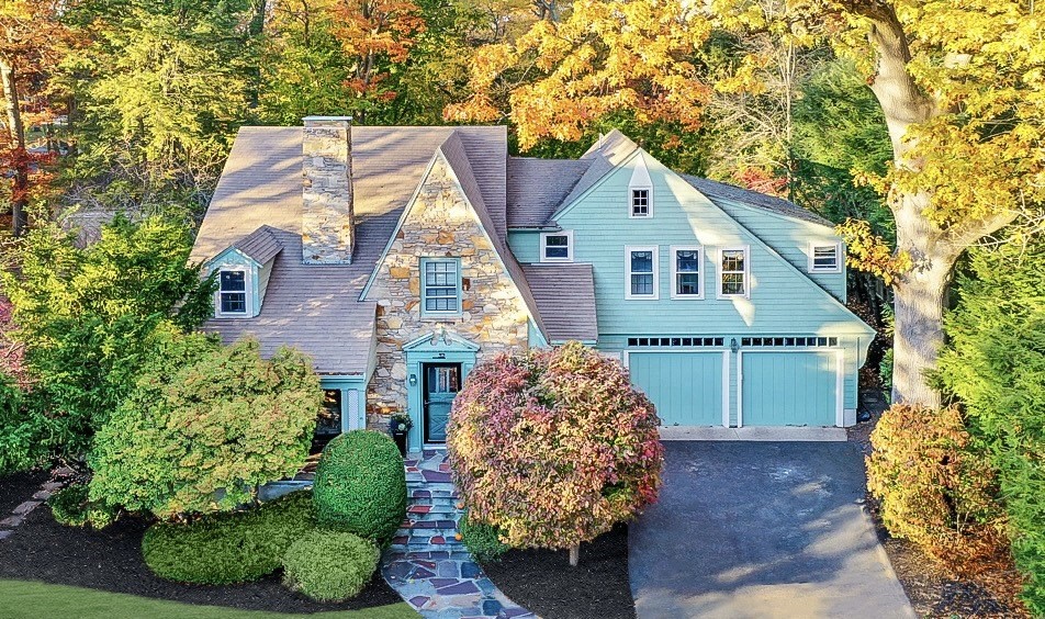 a front view of a house with garden