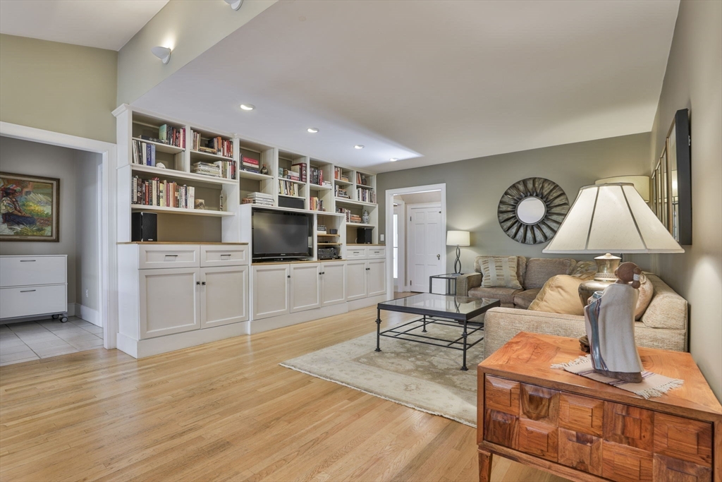 32 Columbine Road Milton, MA 02186 - Photo 14 of 40 a living room with furniture and a flat screen tv