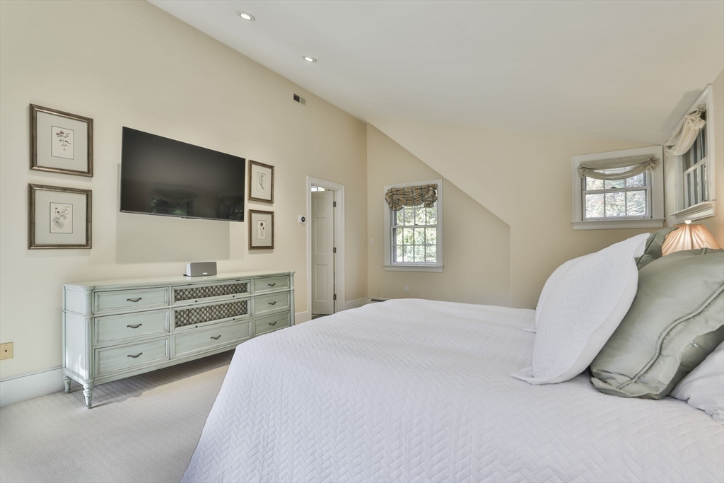 32 Columbine Road Milton, MA 02186 - Photo 23 of 40 a bedroom with a bed and a flat screen tv