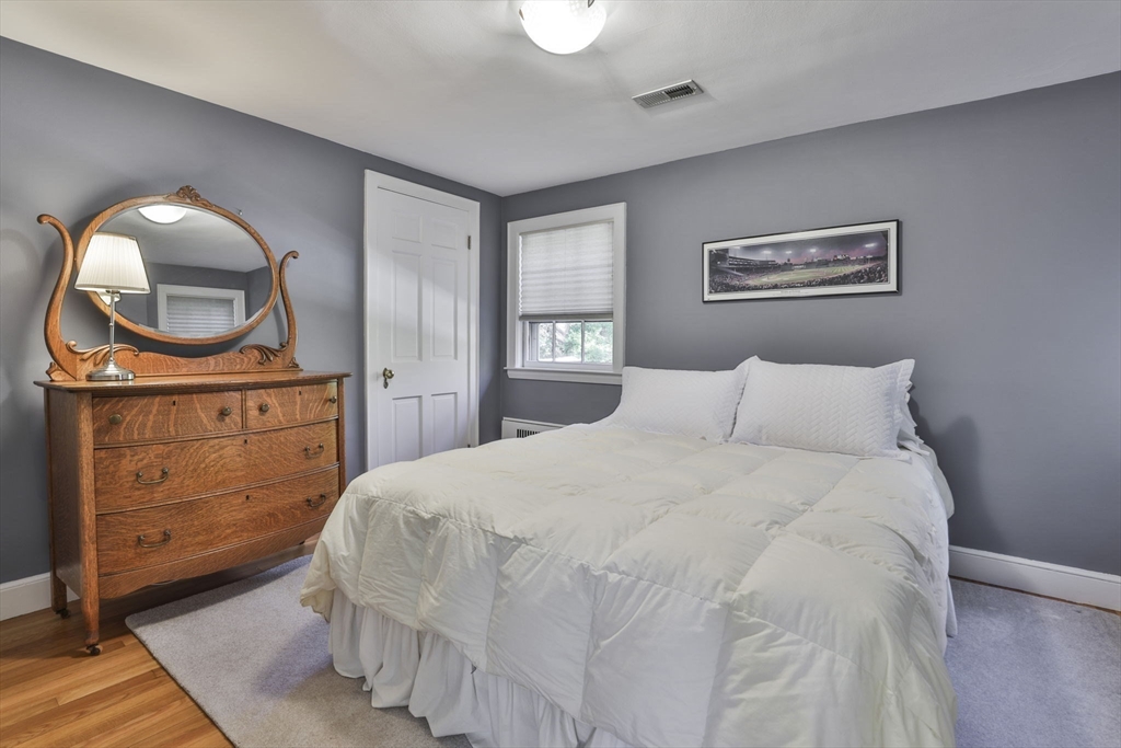 32 Columbine Road Milton, MA 02186 - Photo 26 of 40 a bedroom with a bed and a dresser
