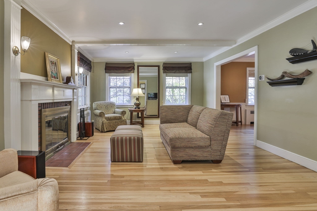 32 Columbine Road Milton, MA 02186 - Photo 3 of 40 a living room with furniture and a fireplace