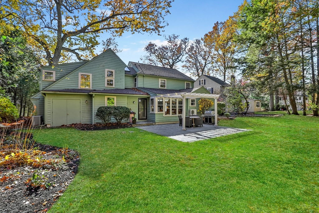 32 Columbine Road Milton, MA 02186 - Photo 38 of 40 a front view of a house with garden and trees