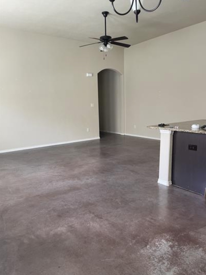 601 Jack Rabbit Lane, Unit B Buda, TX 78610 - Photo 3 of 10 a view of a room with wooden floor and chandelier