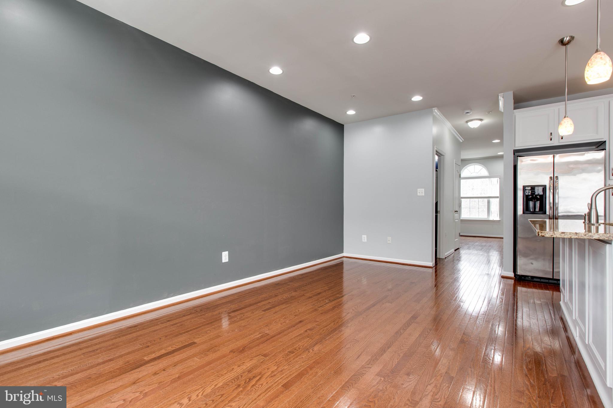 7926 Silver Oak Road Hanover, MD 21076 - Photo 14 of 44 a view of empty room with wooden floor