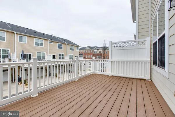 a view of a balcony with wooden floor