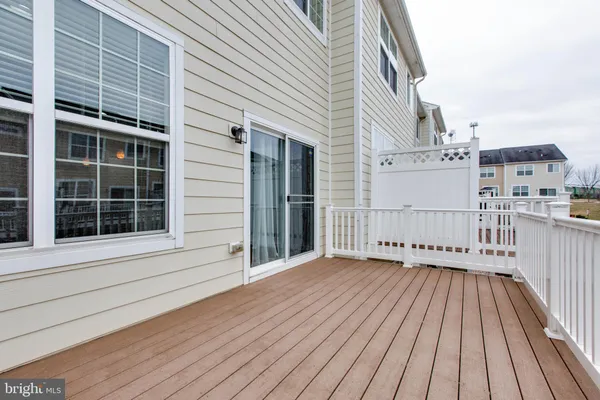 a view of a balcony with wooden floor