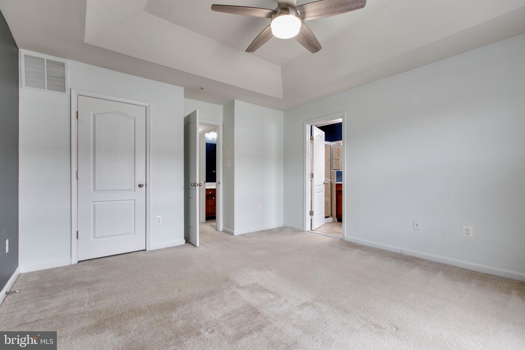 7926 Silver Oak Road Hanover, MD 21076 - Photo 26 of 44 an empty room with fan and entryway