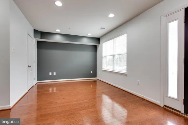a bathroom with a sink mirror and toilet