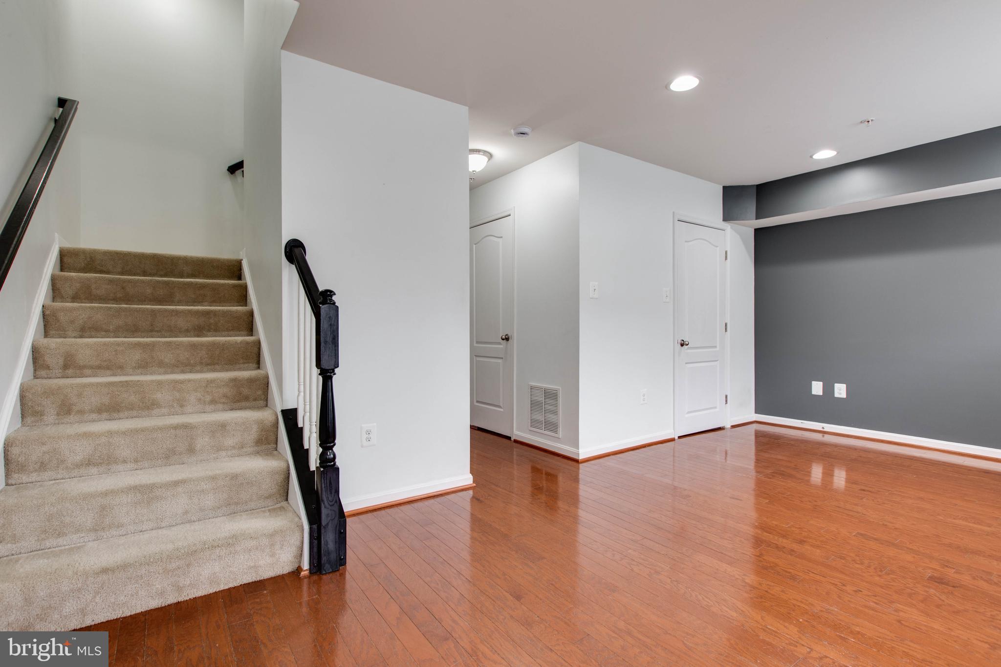 7926 Silver Oak Road Hanover, MD 21076 - Photo 5 of 44 a view of an empty room with wooden floor and entryway