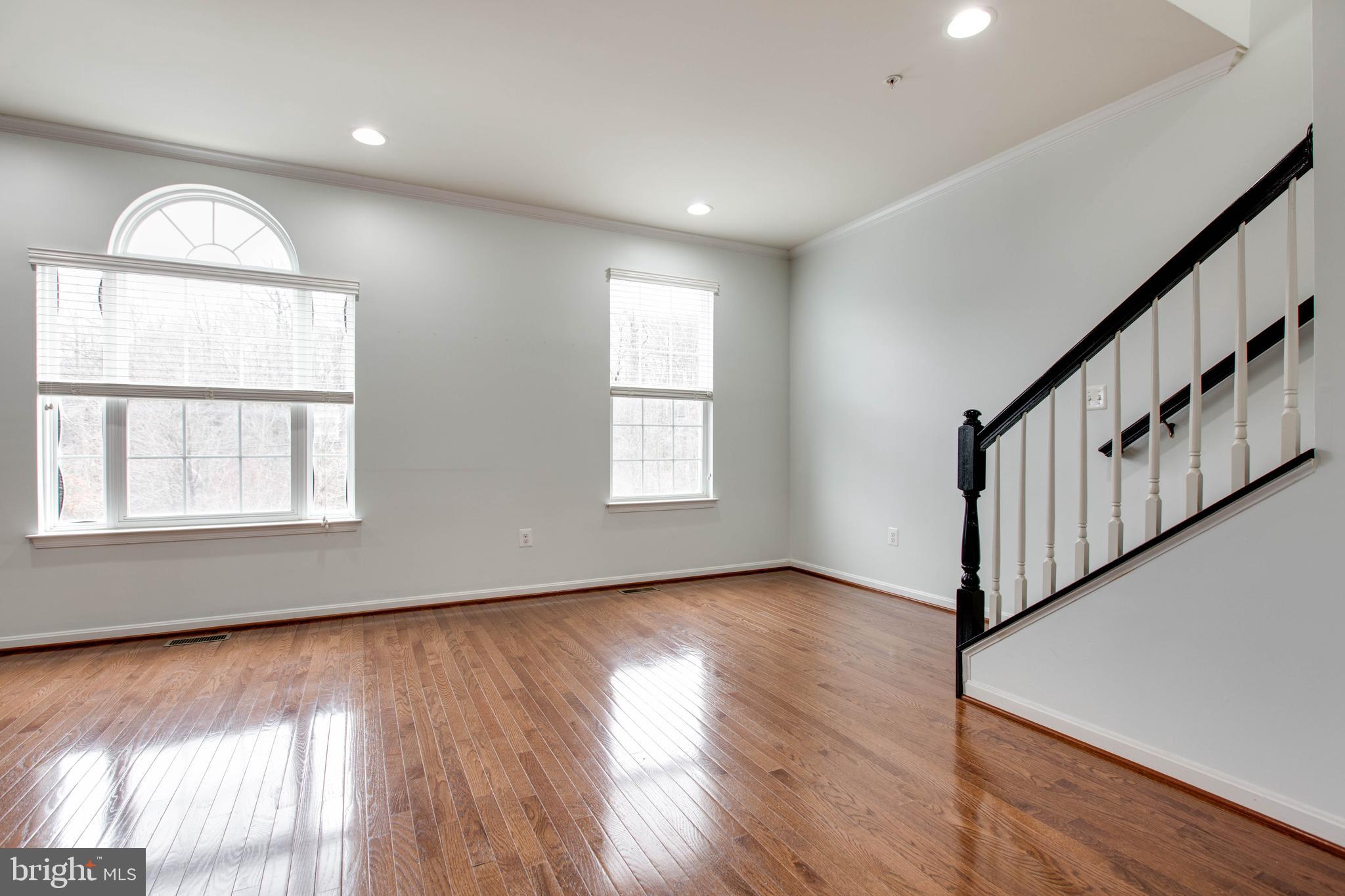 7926 Silver Oak Road Hanover, MD 21076 - Photo 8 of 44 wooden floor in an empty room with a window