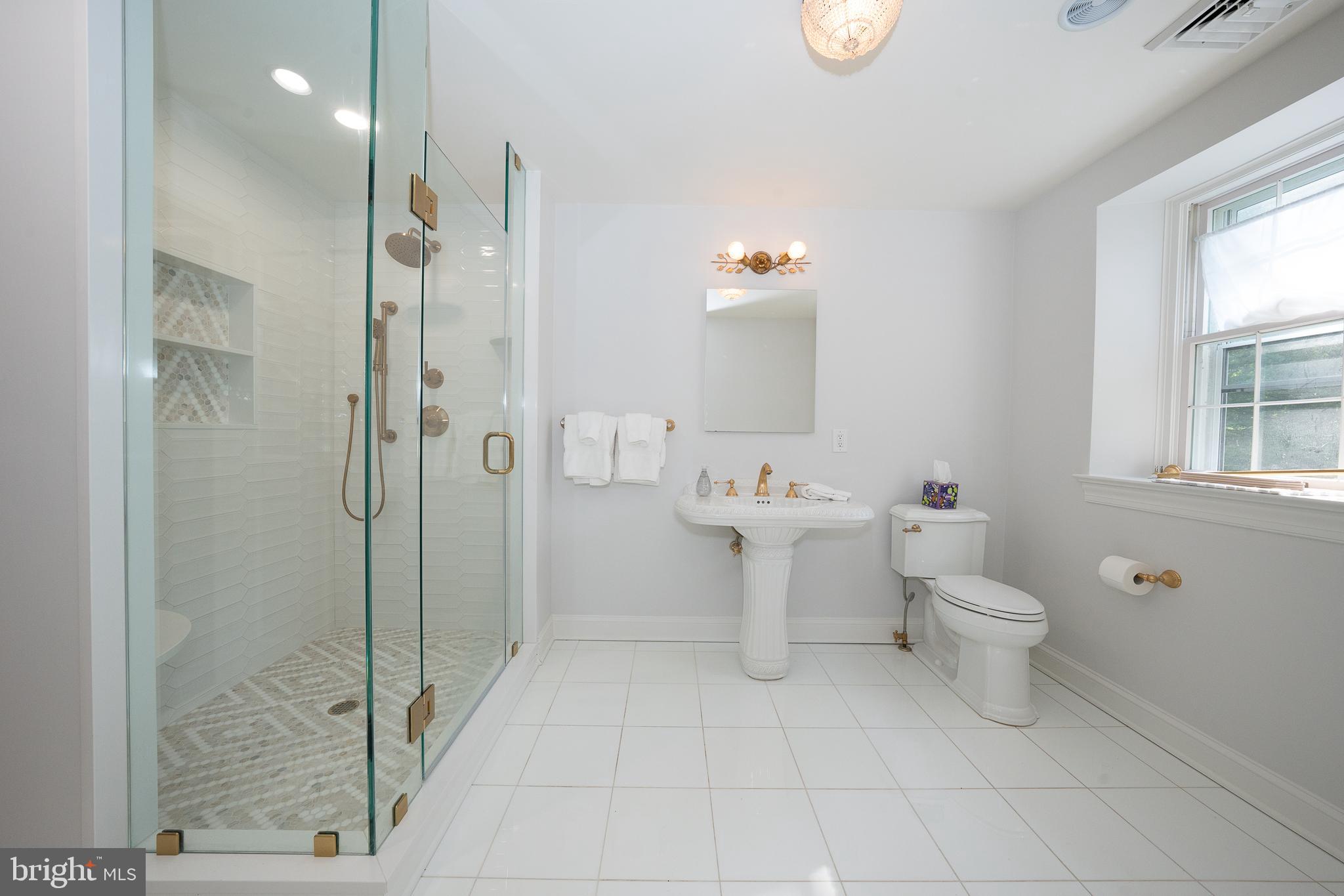 510 Lynmere Road Bryn Mawr, PA 19010 - Photo 23 of 44 a bathroom with a toilet sink and shower