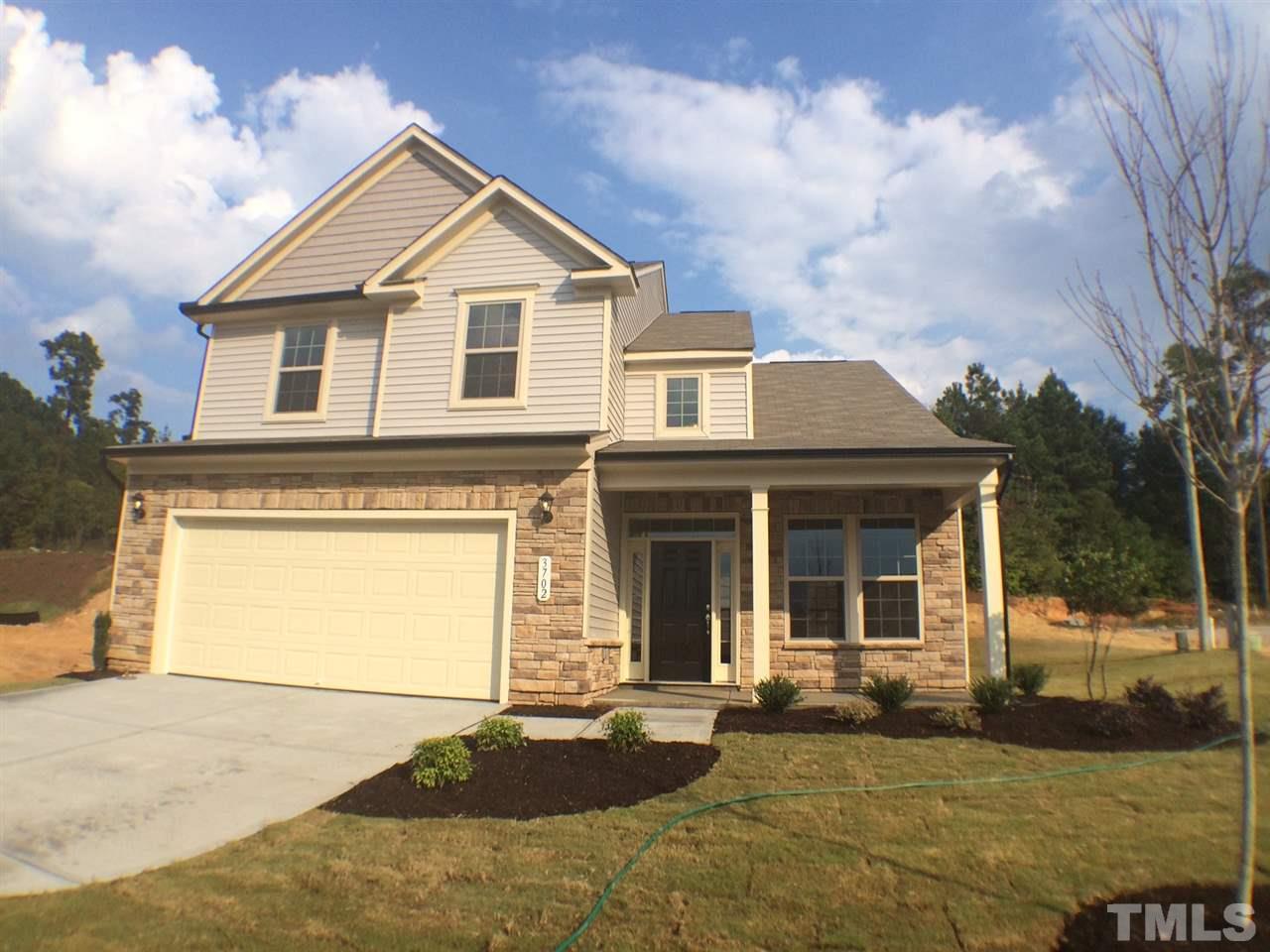 2740 Shepherd Valley Street Raleigh, NC 27610 - Photo 1 of 15 a front view of a house with a yard and garage