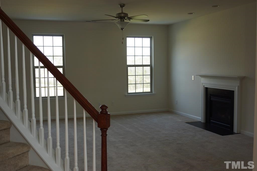 2740 Shepherd Valley Street Raleigh, NC 27610 - Photo 2 of 15 wooden floor in an empty room with a window