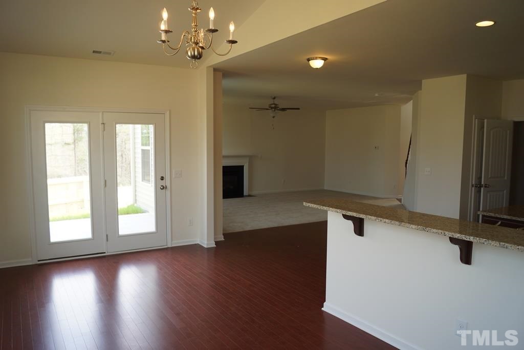 2740 Shepherd Valley Street Raleigh, NC 27610 - Photo 9 of 15 wooden floor in an empty room with a window