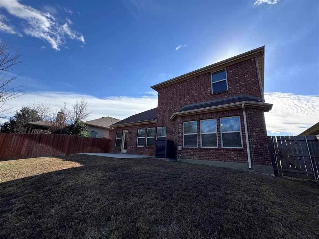 6549 Compass Ridge Drive Dallas, TX 75249 - Photo 18 of 19 a front view of a house with a yard