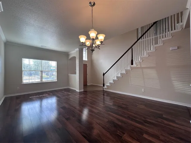 a view of an entryway with wooden floor