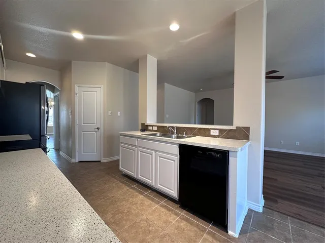 a large bathroom with a sink and a large mirror