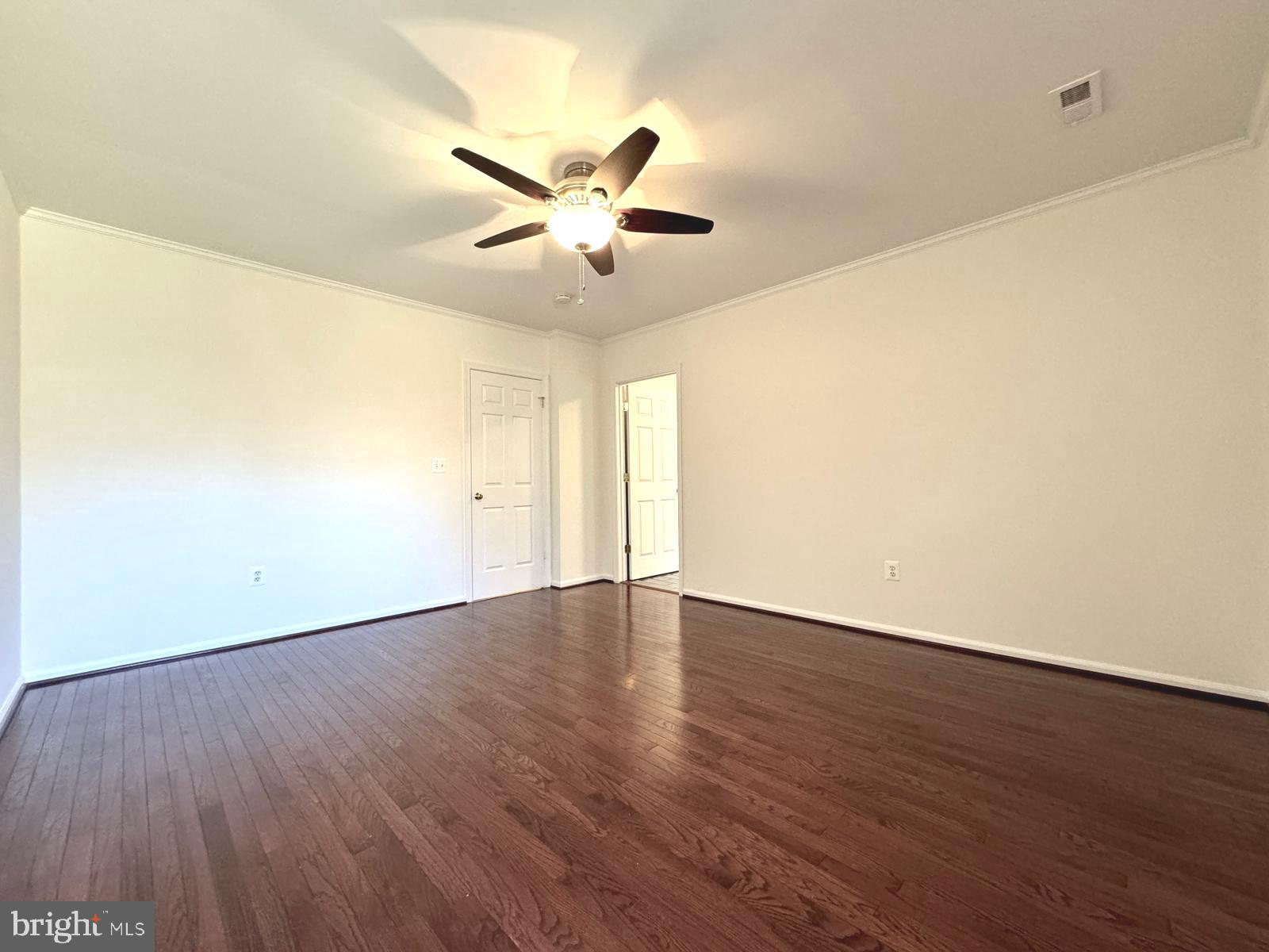 1447 Hampton Hill Circle McLean, VA 22101 - Photo 20 of 46 a view of an empty room with wooden floor and a window