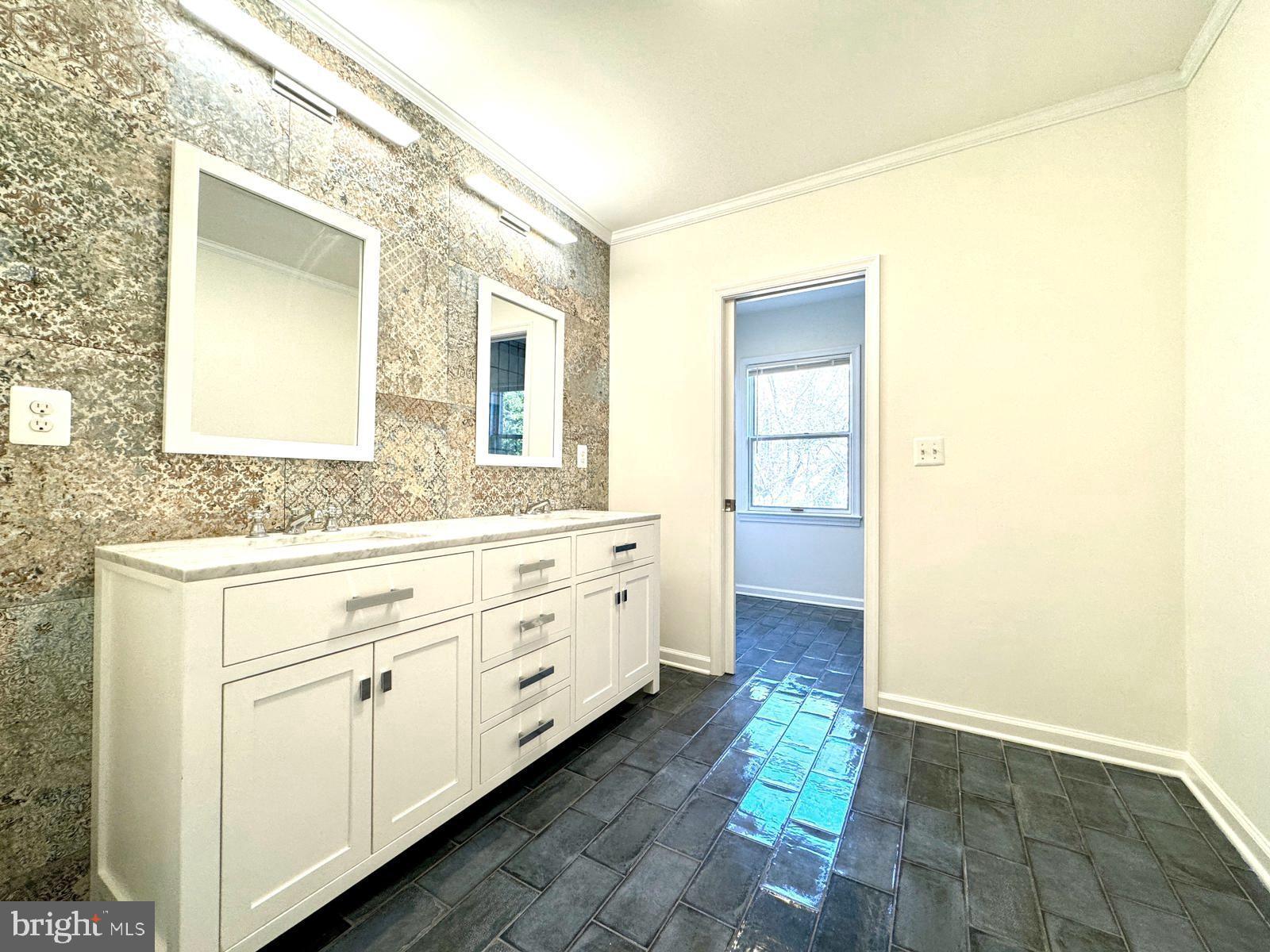 1447 Hampton Hill Circle McLean, VA 22101 - Photo 22 of 46 a bathroom with a double vanity sink and mirror