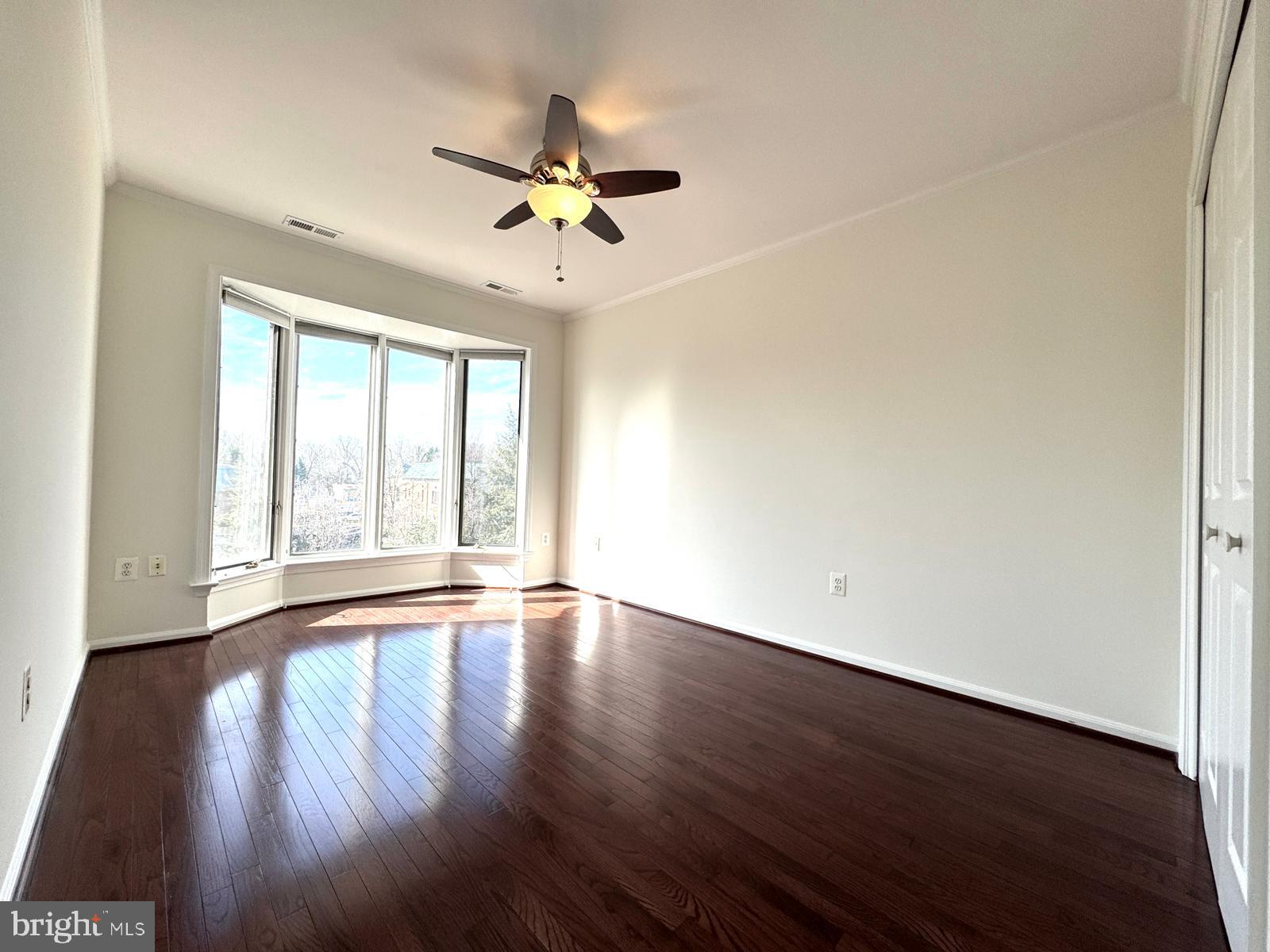 1447 Hampton Hill Circle McLean, VA 22101 - Photo 30 of 46 a view of an empty room with wooden floor and a window