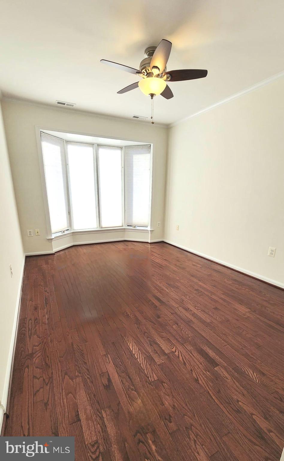 1447 Hampton Hill Circle McLean, VA 22101 - Photo 31 of 46 an empty room with wooden floor and windows