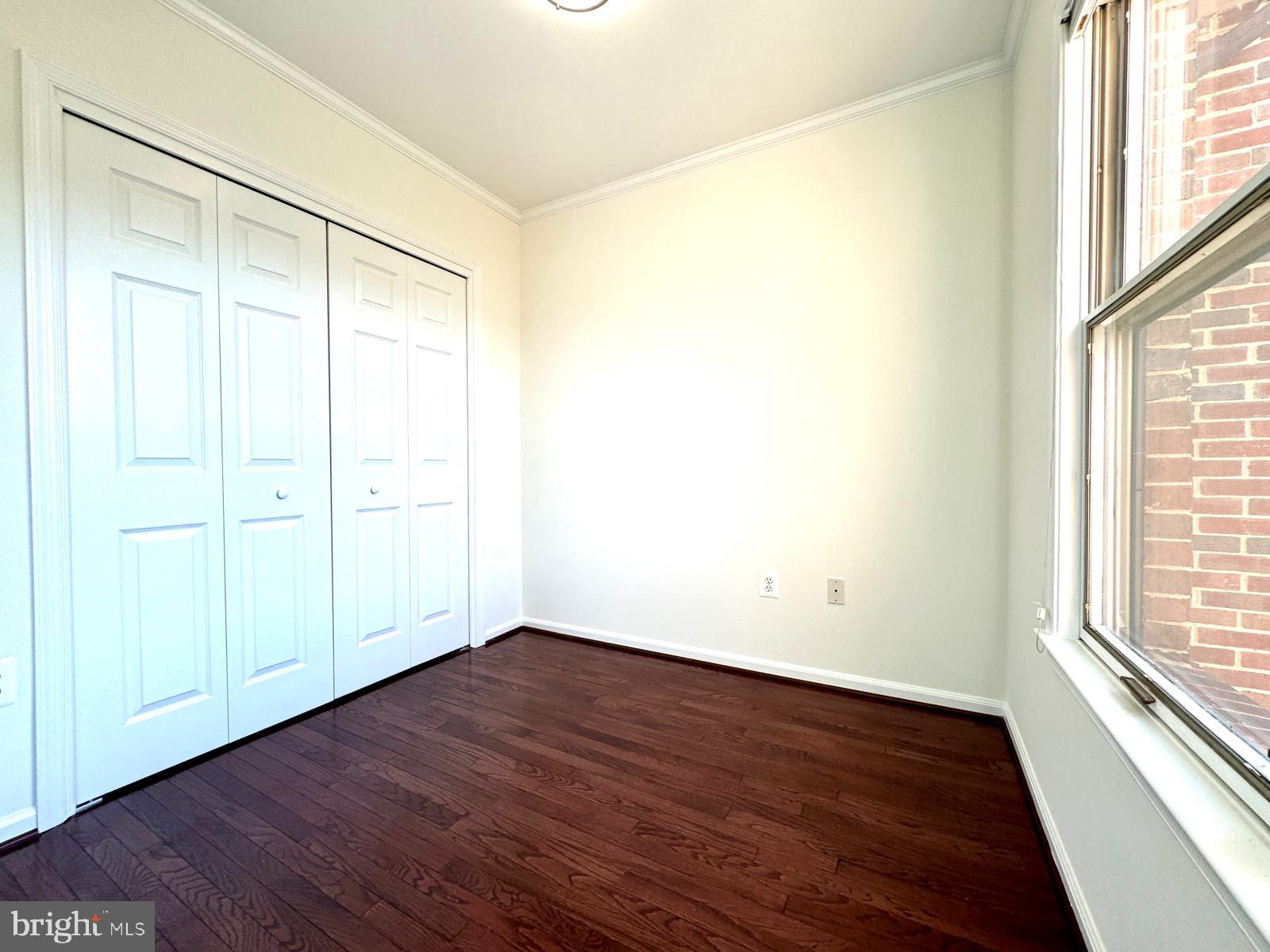 1447 Hampton Hill Circle McLean, VA 22101 - Photo 34 of 46 a view of an empty room with wooden floor and a window