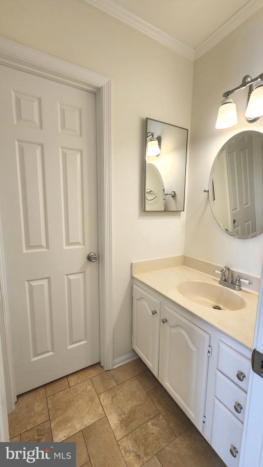 1447 Hampton Hill Circle McLean, VA 22101 - Photo 35 of 46 a bathroom with a sink and a mirror