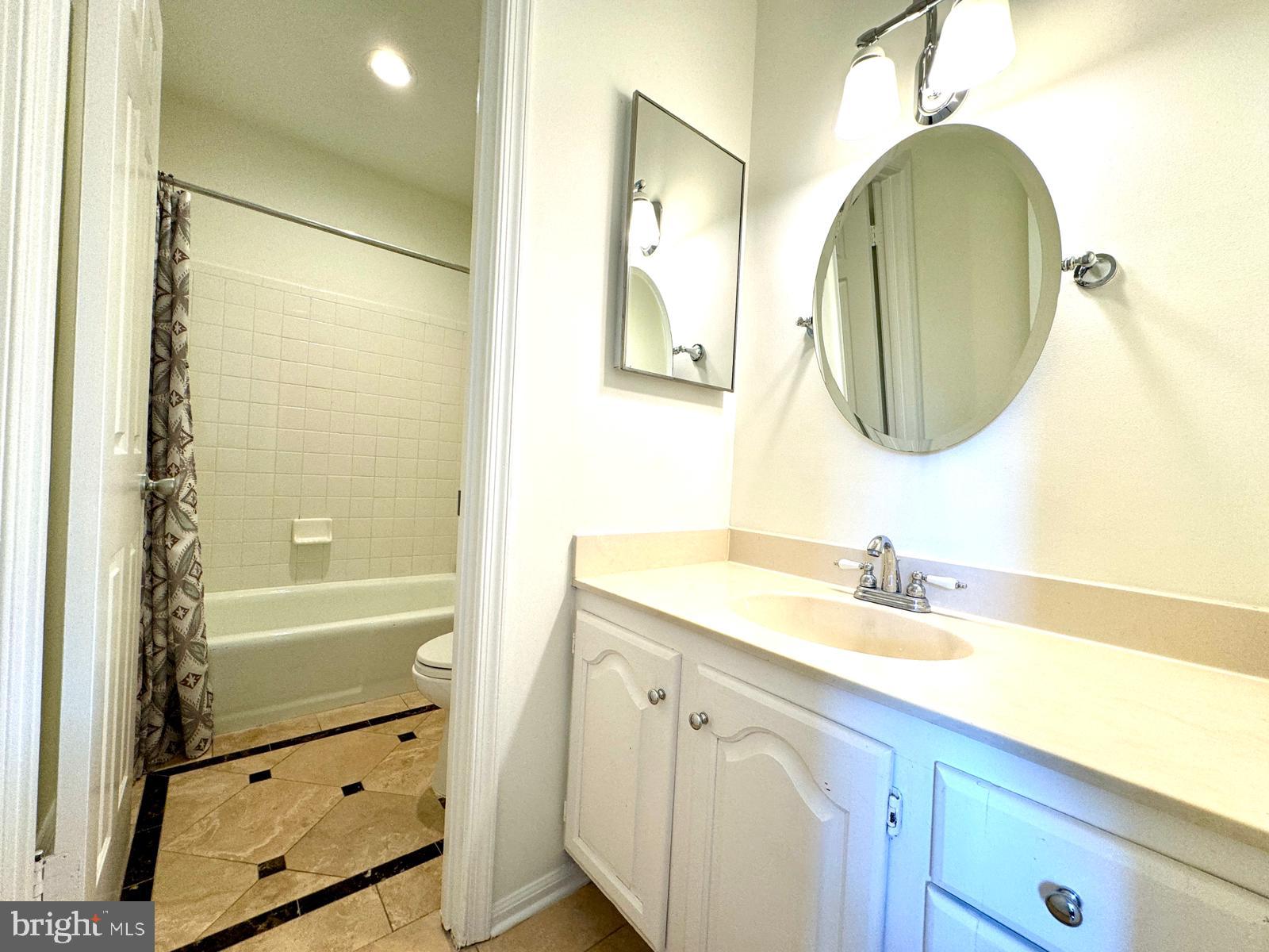 1447 Hampton Hill Circle McLean, VA 22101 - Photo 36 of 46 a bathroom with a sink double vanity and a mirror