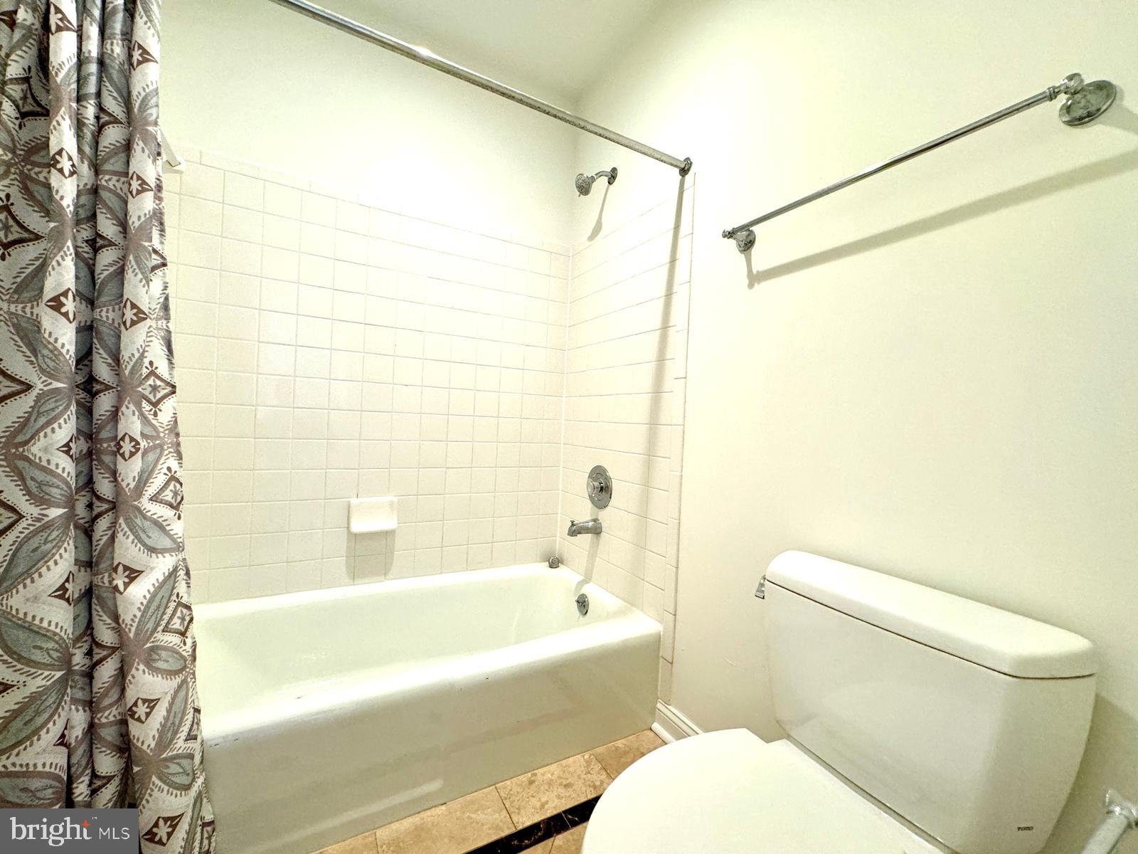 1447 Hampton Hill Circle McLean, VA 22101 - Photo 37 of 46 a bathroom with a toilet and a bathtub