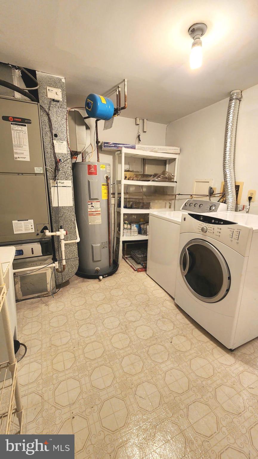1447 Hampton Hill Circle McLean, VA 22101 - Photo 42 of 46 a kitchen with a stove a refrigerator and washer