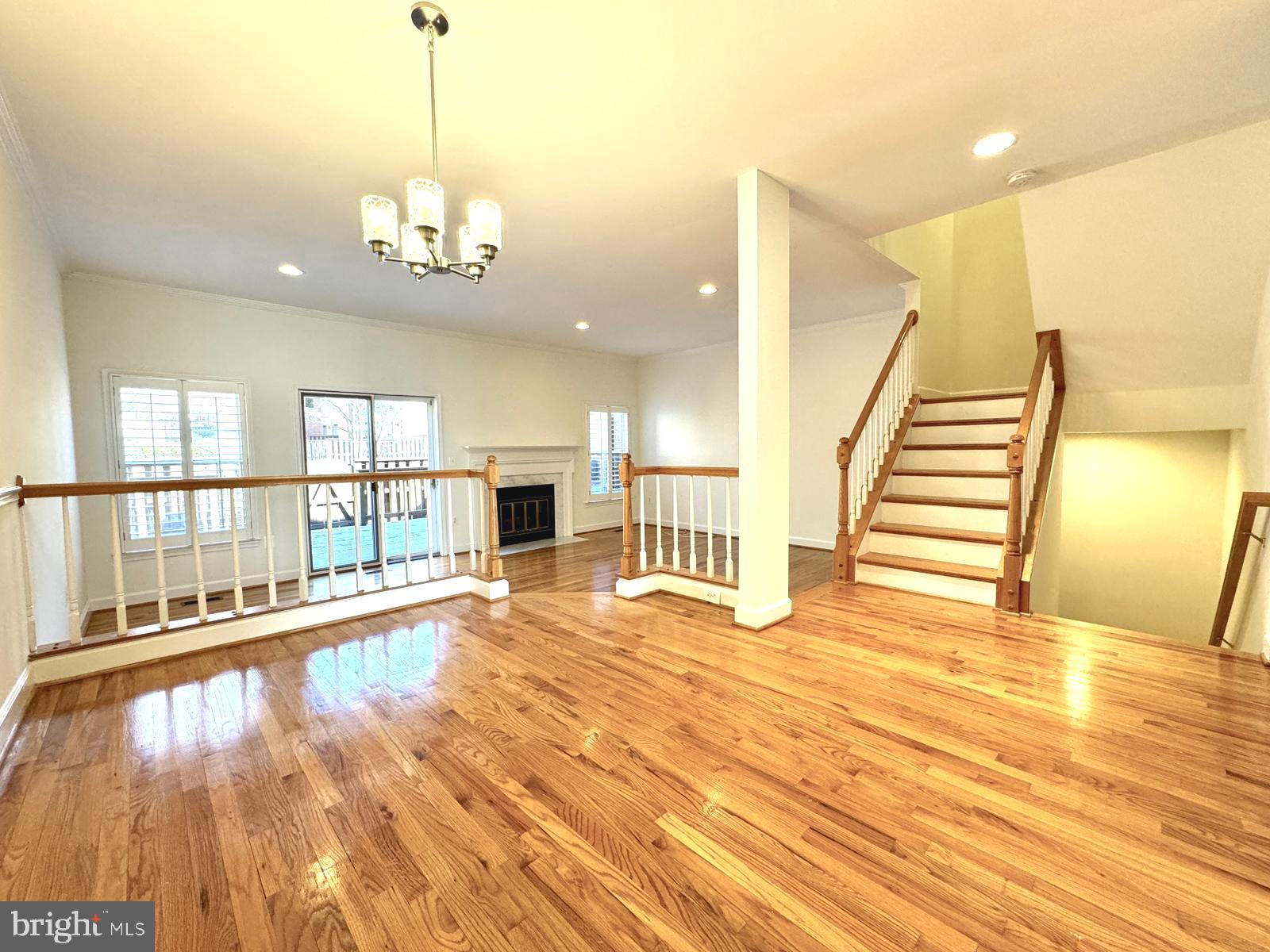 1447 Hampton Hill Circle McLean, VA 22101 - Photo 9 of 46 a view of a room with wooden floor stairs and windows