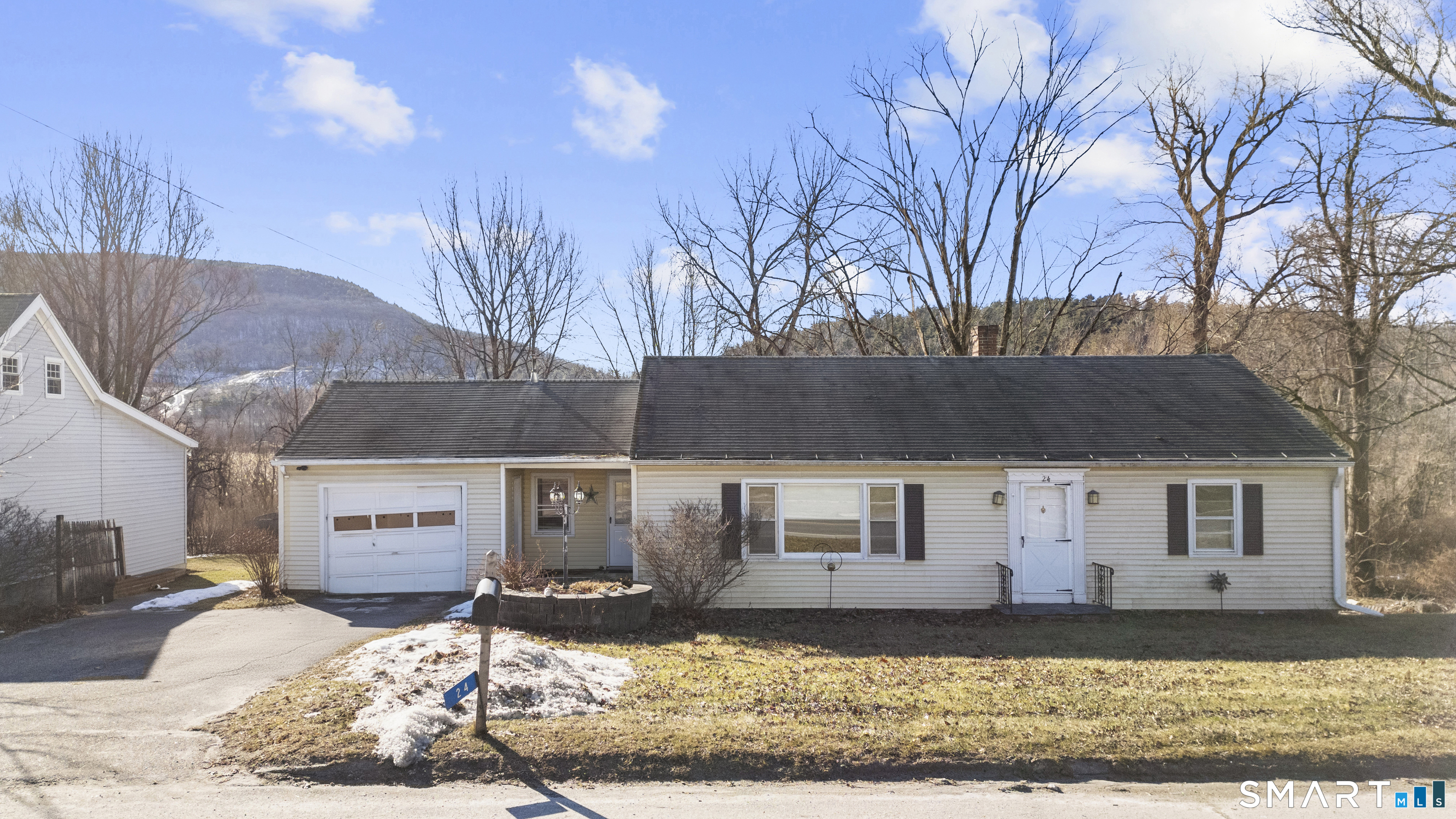 a front view of a house with a yard