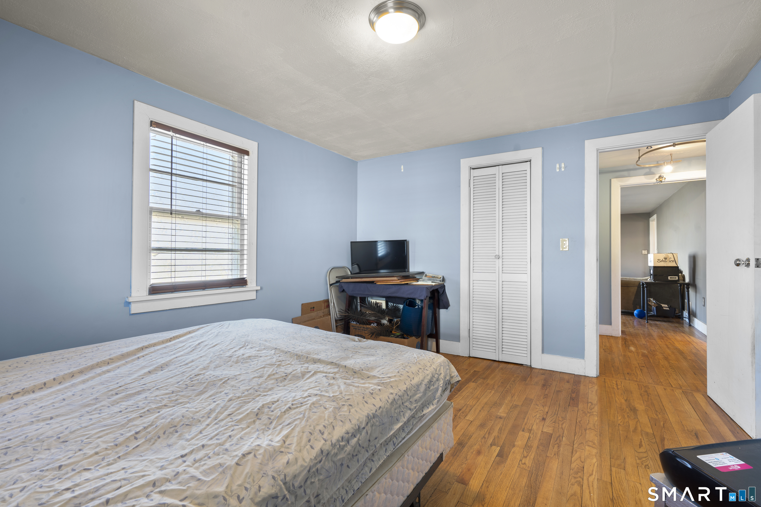 24 East Main Street North Canaan, CT 06018 - Photo 12 of 31 a bedroom with a bed and wooden floor