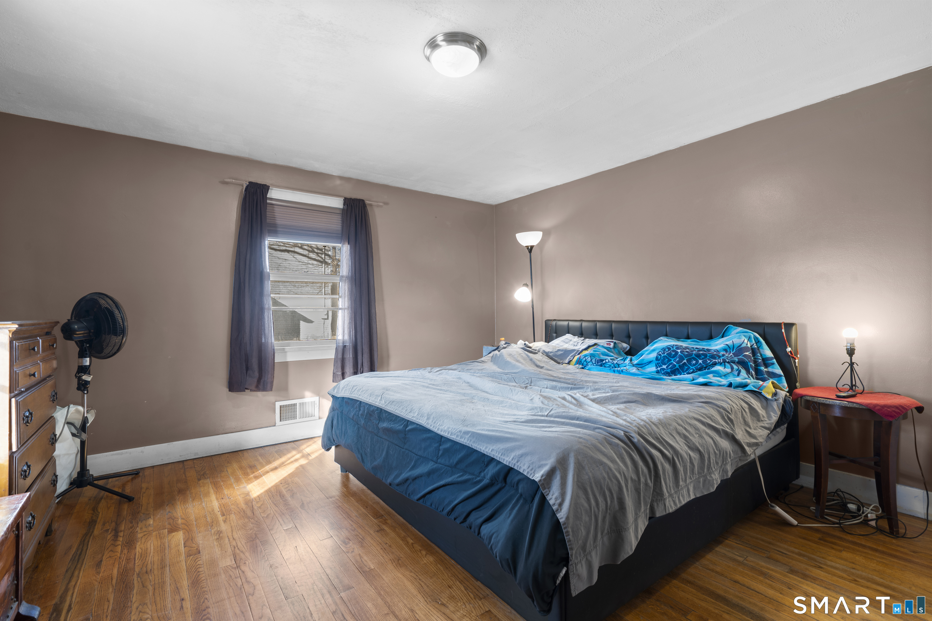 24 East Main Street North Canaan, CT 06018 - Photo 13 of 31 a bedroom with a bed and wooden floor