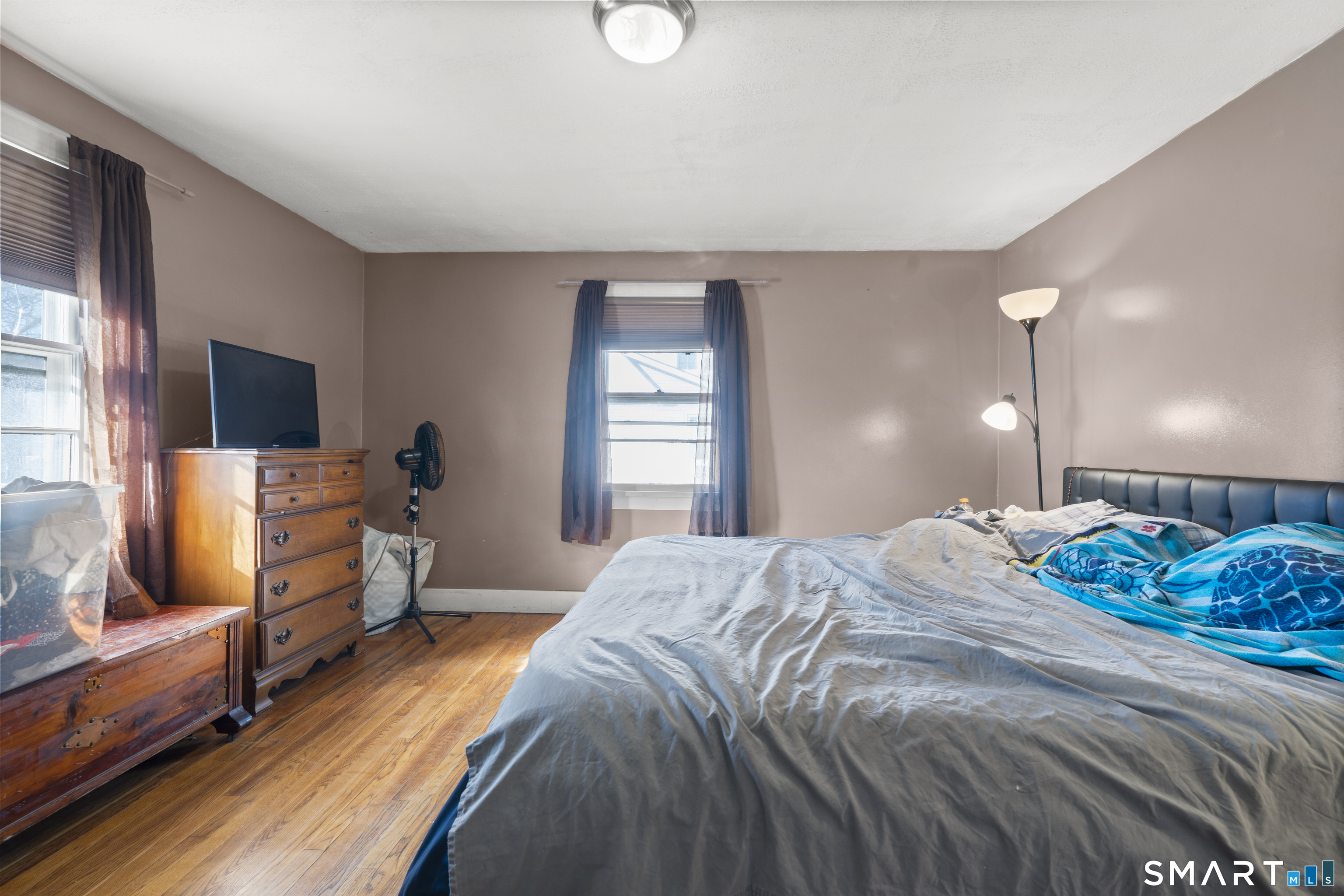 24 East Main Street North Canaan, CT 06018 - Photo 14 of 31 a bedroom with a bed and flat screen tv