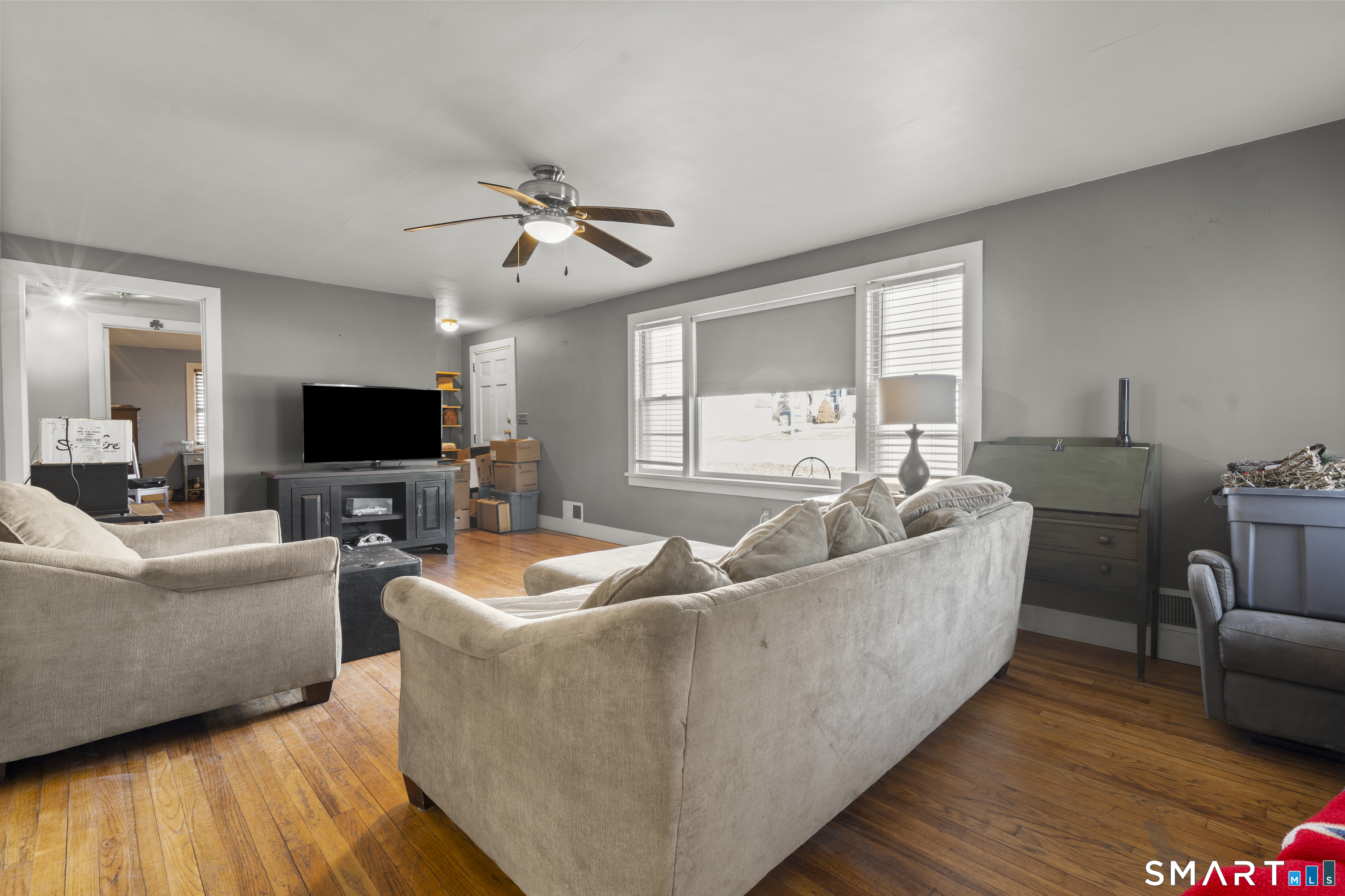 24 East Main Street North Canaan, CT 06018 - Photo 7 of 31 a living room with furniture and a flat screen tv