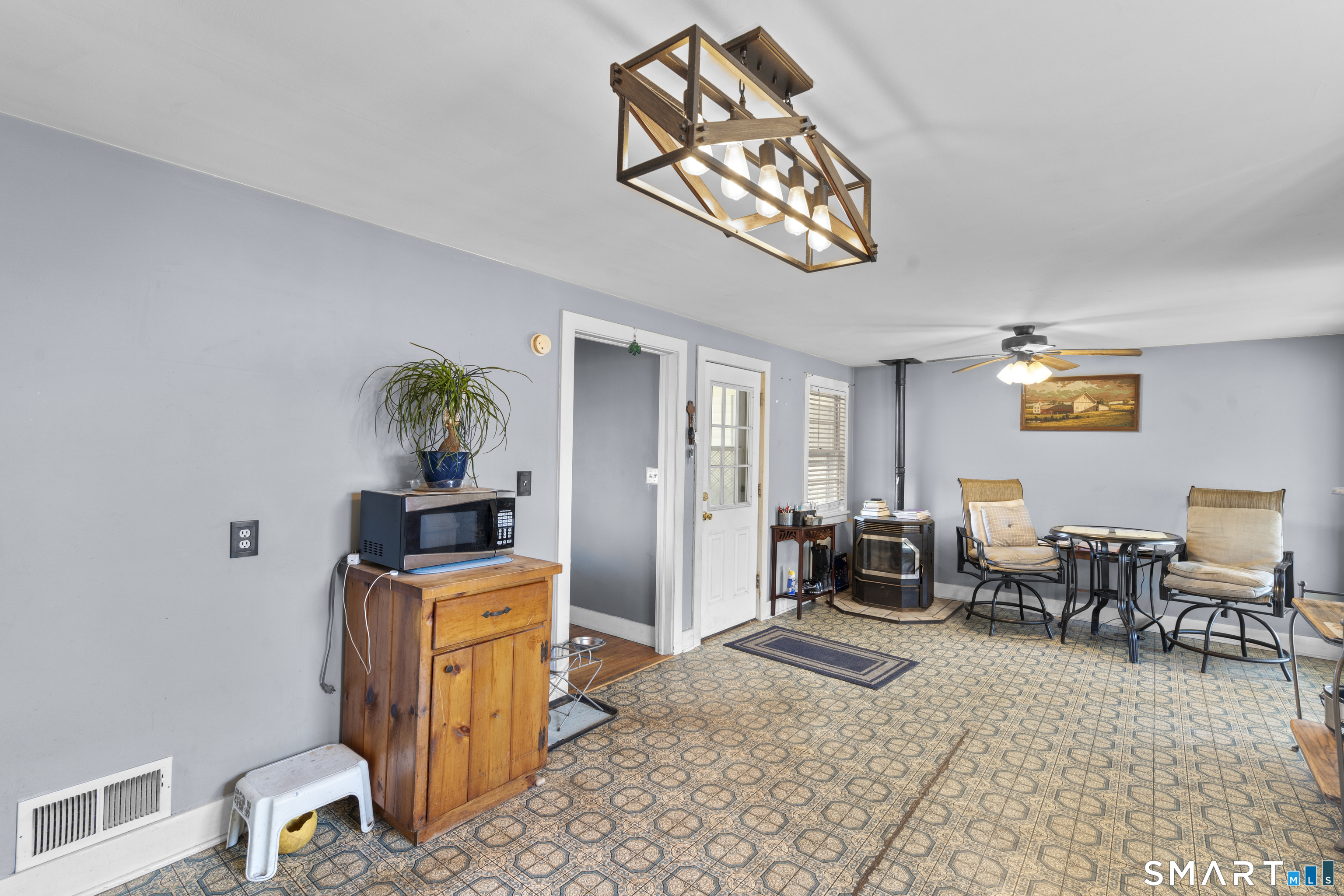 24 East Main Street North Canaan, CT 06018 - Photo 10 of 31 a living room with furniture a rug and a chandelier