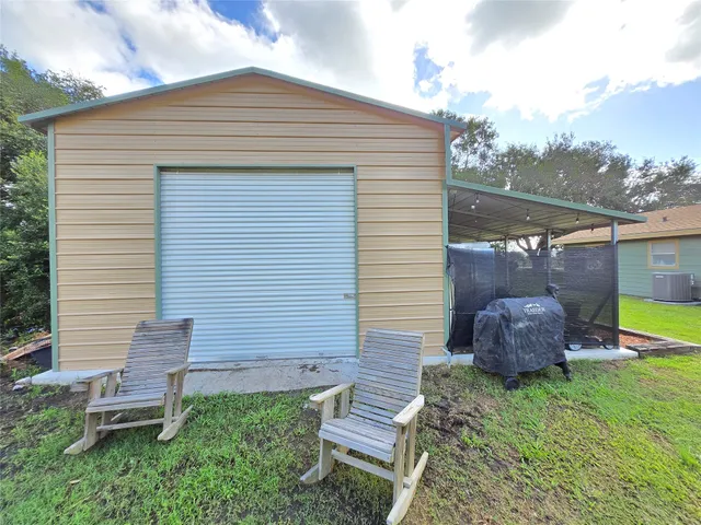 a backyard of a house with seating space