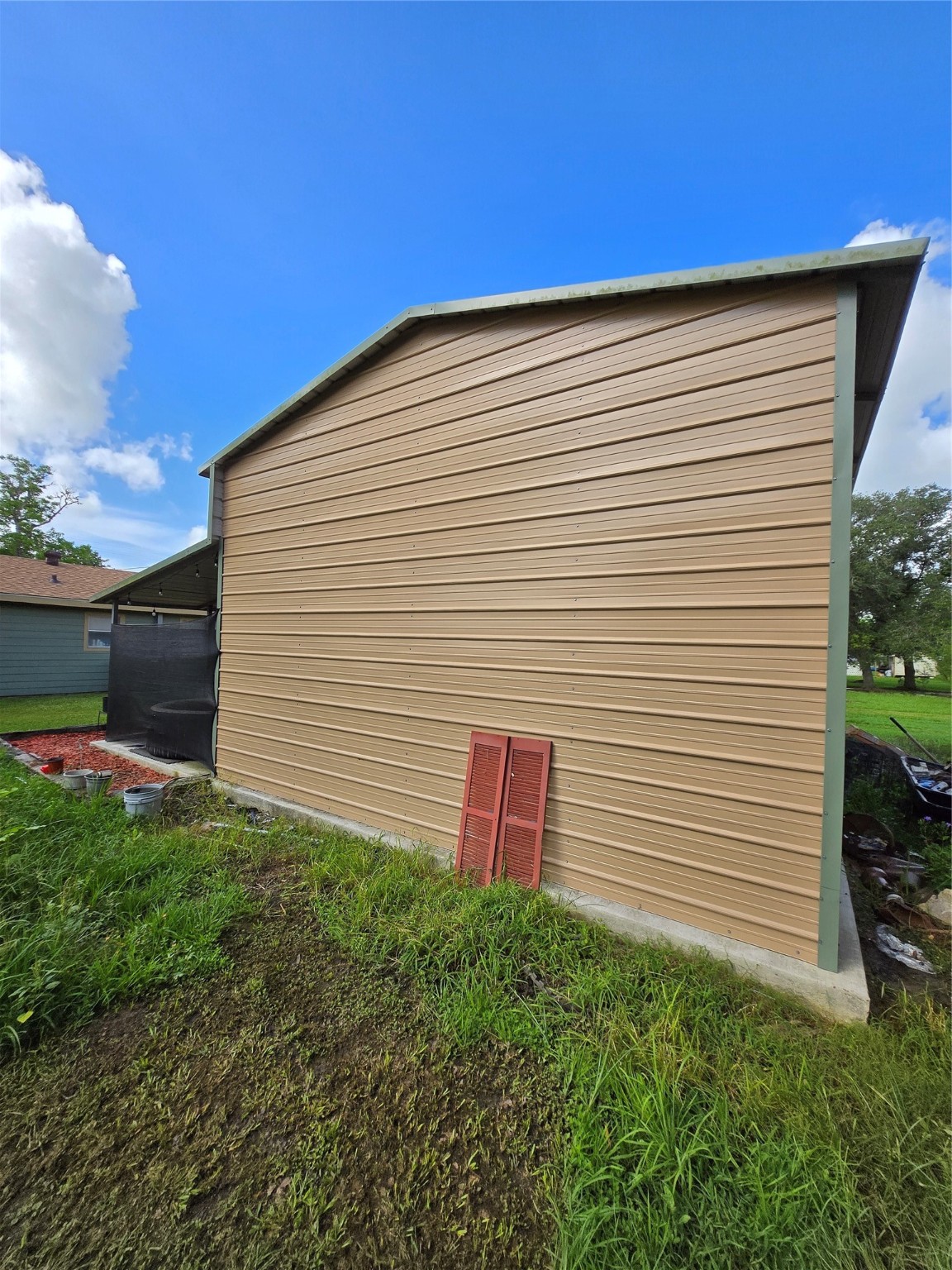 610 East Division Street Edna, TX 77957 - Photo 15 of 38 a view of a backyard with plants